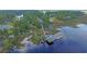 Aerial image highlighting the home's waterfront location with a private dock, boathouse, and access to the river at 4385 Ten Shillings Way, Hollywood, SC 29470
