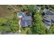 Aerial view of the property highlighting pool, spa, boardwalk, and lush landscaping at 4385 Ten Shillings Way, Hollywood, SC 29470