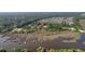 A sprawling aerial view showcasing the community with lush greenery and waterfront access at 4385 Ten Shillings Way, Hollywood, SC 29470