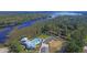 Aerial view of a community pool, pool house and parking area with river and marsh views at 4385 Ten Shillings Way, Hollywood, SC 29470
