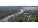 Scenic aerial view of a waterfront property with private docks, lush greenery and tranquil waterways at 4385 Ten Shillings Way, Hollywood, SC 29470