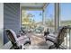 Inviting covered back porch with seating overlooking the serene backyard at 4385 Ten Shillings Way, Hollywood, SC 29470