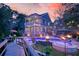 Stunning backyard featuring a luxurious pool, hot tub, and outdoor lighting for evening enjoyment at 4385 Ten Shillings Way, Hollywood, SC 29470