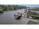 Picturesque dock with boat lift and cover, complemented by tranquil waters and lush surroundings at 4385 Ten Shillings Way, Hollywood, SC 29470