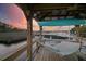 Dock with boat lift, hammock, and kayak storage offering serene waterfront living and recreation at 4385 Ten Shillings Way, Hollywood, SC 29470