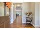 Elegant foyer with hardwood floors, complemented by a stylish accent table and an eye-catching wreath at 4385 Ten Shillings Way, Hollywood, SC 29470