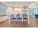 Well-lit kitchen featuring a large island, barstool seating, stainless appliances, and ample prep space at 4385 Ten Shillings Way, Hollywood, SC 29470