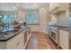 Well-appointed kitchen with stainless appliances, granite countertops, and custom cabinetry at 4385 Ten Shillings Way, Hollywood, SC 29470