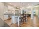 Modern kitchen featuring a large center island, stainless steel appliances, and an elegant backsplash at 4385 Ten Shillings Way, Hollywood, SC 29470