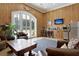 View of the lounge area with bar, seating, and natural wood walls at 4385 Ten Shillings Way, Hollywood, SC 29470