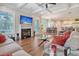 Bright and airy living room with fireplace, coffered ceilings, and seamless flow to the dining area at 4385 Ten Shillings Way, Hollywood, SC 29470