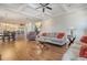 Open-concept living area featuring hardwood floors and coffered ceiling at 4385 Ten Shillings Way, Hollywood, SC 29470