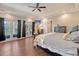 Spacious main bedroom featuring hardwood floors and private balcony access at 4385 Ten Shillings Way, Hollywood, SC 29470