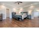 Comfortable main bedroom with hardwood floors and neutral wall colors at 4385 Ten Shillings Way, Hollywood, SC 29470