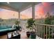 Cozy covered porch with beautiful plants, and a scenic view at 4385 Ten Shillings Way, Hollywood, SC 29470