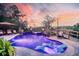 Outdoor area with pool, fire bowls, hot tub, umbrella, lounge chairs, string lights, travertine deck at 4385 Ten Shillings Way, Hollywood, SC 29470