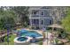 Stunning backyard pool and spa with luxurious lounge seating, perfect for relaxation and entertaining at 4385 Ten Shillings Way, Hollywood, SC 29470