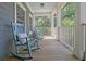 Charming front porch with rocking chairs, offering a relaxing outdoor seating area at 4385 Ten Shillings Way, Hollywood, SC 29470