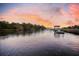 Picturesque view of waterfront docks and serene waters, offering a tranquil setting at 4385 Ten Shillings Way, Hollywood, SC 29470