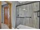 Modern bathroom with a stand up shower with dark trim and stone look walls at 522 W Butternut Rd, Summerville, SC 29483
