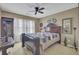 Bedroom with a dark wood bedframe, lots of natural light, and a ceiling fan at 522 W Butternut Rd, Summerville, SC 29483