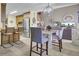 Bright dining area with breakfast bar seating and views of stainless steel refrigerator at 522 W Butternut Rd, Summerville, SC 29483