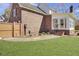 Exterior view of a brick home with a sunroom addition and a well-kept lawn at 522 W Butternut Rd, Summerville, SC 29483
