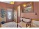 Inviting foyer with hardwood floors, a stylish light fixture, and comfortable seating at 522 W Butternut Rd, Summerville, SC 29483