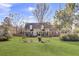 Charming brick home with a large front yard, dormer windows, and inviting front porch at 522 W Butternut Rd, Summerville, SC 29483