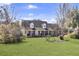 Charming brick home with a large front yard, dormer windows, and inviting front porch at 522 W Butternut Rd, Summerville, SC 29483