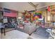 Finished garage featuring a motorcycle, colorful decor, and a television area at 522 W Butternut Rd, Summerville, SC 29483