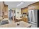 Bright kitchen with wood cabinetry, center island, and view into dining area at 522 W Butternut Rd, Summerville, SC 29483