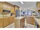 Traditional kitchen with wooden cabinets, center island, and stainless steel refrigerator at 522 W Butternut Rd, Summerville, SC 29483