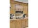 Close up of the kitchen with wood cabinets, stainless steel appliances, and modern fixtures at 522 W Butternut Rd, Summerville, SC 29483