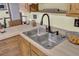 Traditional kitchen with stainless steel sink, wooden cabinets, and neutral countertops at 522 W Butternut Rd, Summerville, SC 29483
