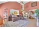 Spacious living room featuring a high ceiling, comfortable seating, and seamless flow to the kitchen at 522 W Butternut Rd, Summerville, SC 29483