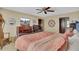 Main bedroom features a television, a ceiling fan, and an exit into a closet at 522 W Butternut Rd, Summerville, SC 29483