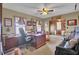 Spacious home office with wood desk, ceiling fan, and comfortable furnishings at 522 W Butternut Rd, Summerville, SC 29483