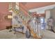 Elegant staircase with carpeted steps and decorative accents, enhancing the home's appeal at 522 W Butternut Rd, Summerville, SC 29483