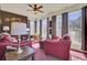 Sunroom with an oversized lamp and red chairs at 522 W Butternut Rd, Summerville, SC 29483