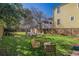 A spacious backyard featuring comfortable seating arrangement and lush green grass at 53 America St, Charleston, SC 29403