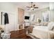 Bright bedroom features a decorative brick fireplace, hardwood floors, and a ceiling fan at 53 America St, Charleston, SC 29403