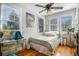 Bright bedroom featuring hardwood floors, natural light, and cozy decor with vintage poster at 53 America St, Charleston, SC 29403
