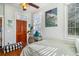 Bright bedroom featuring hardwood floors, natural light, and cozy decor with vintage poster at 53 America St, Charleston, SC 29403