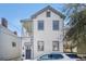 Charming two-story home with white siding, grey trim and a cozy front porch at 53 America St, Charleston, SC 29403