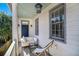 Inviting front porch features a cozy seating area and charming details, perfect for relaxing outdoors at 53 America St, Charleston, SC 29403