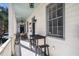 Relaxing front porch with outdoor seating, perfect for enjoying the neighborhood ambiance and warm days at 53 America St, Charleston, SC 29403