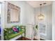 Entryway with a decorative mirror, staircase, and a charming wooden bench at 53 America St, Charleston, SC 29403
