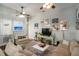 Bright living room with eclectic decor, comfortable seating, and a cozy atmosphere at 53 America St, Charleston, SC 29403
