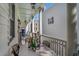Charming porch featuring dining table, seating, and bright decor, perfect for relaxing or entertaining guests at 53 America St, Charleston, SC 29403